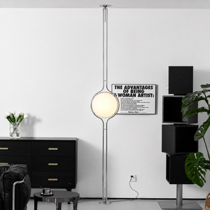 Oris floor to ceiling lamp in Silver in a living room, real product photo