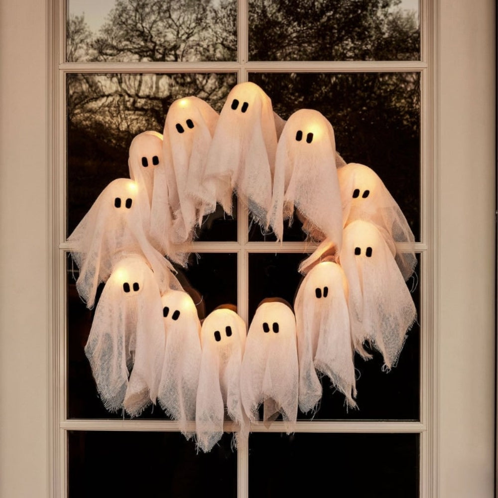 Lighted ghost wreath on a white background