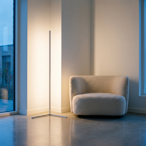 Aurel Corner Floor Lamp in white, lighting the corner of a modern living room