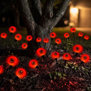 Red glowing eye orbs at the base of a tree at night