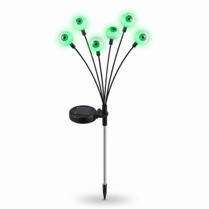Solar eyeball garden stake light with six glowing green eyeball heads on a white background