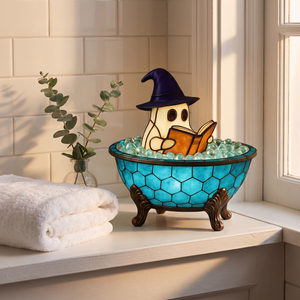 Bathtub Boo ghost lamp glowing on a bathroom windowsill