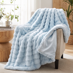 Cozy blue faux fur throw across a reading chair