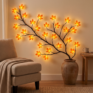 Maple LED branch light in a floor vase beside a reading chair