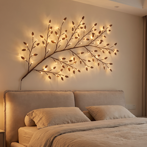 Leaflet LED branch light mounted above a headboard