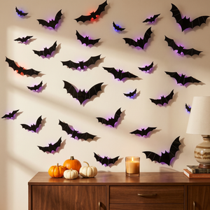 3D bat wall decor cluster on a living room wall with Halloween decor
