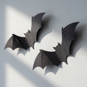 Close-up of 3D bat wall decals showing paper texture and standoff shadow
