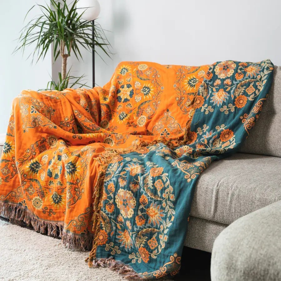 Marigold reversible cotton gauze throw blanket folded on a white background