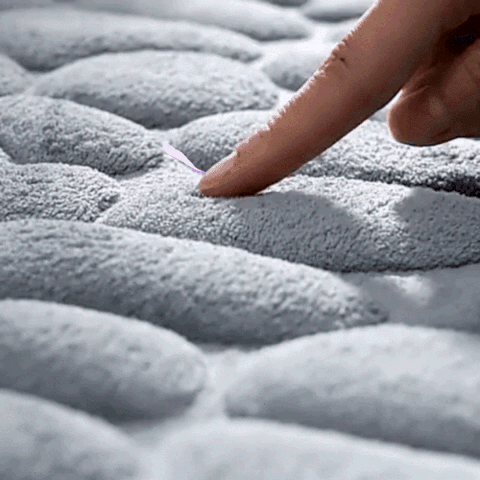 Cobblestone bath mat texture close up