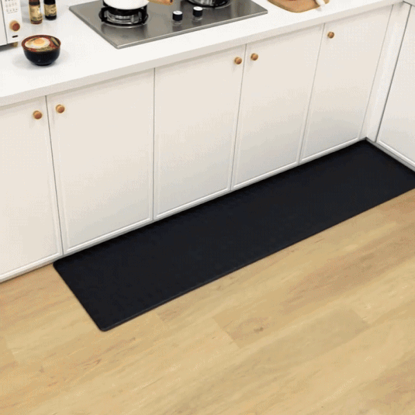 Cushioned kitchen runner mat in front of a kitchen counter