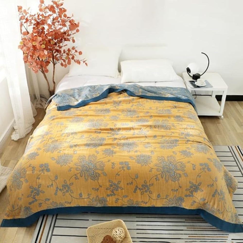 Floral Dream cotton blanket on a bed