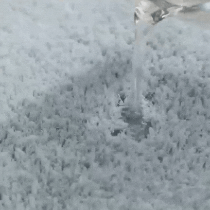 Plush microfiber bath rug in use