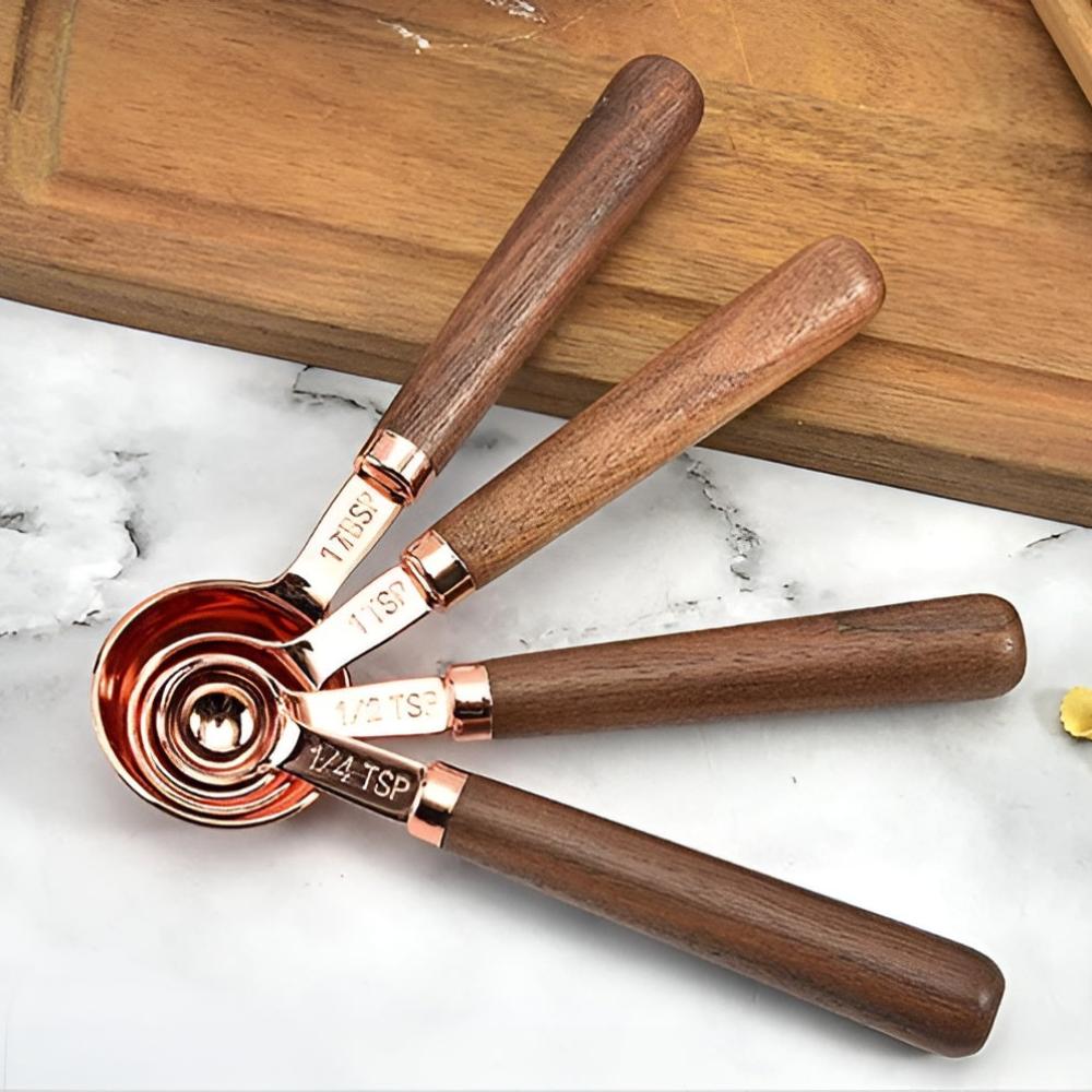 Copper measuring cups and spoons detail view