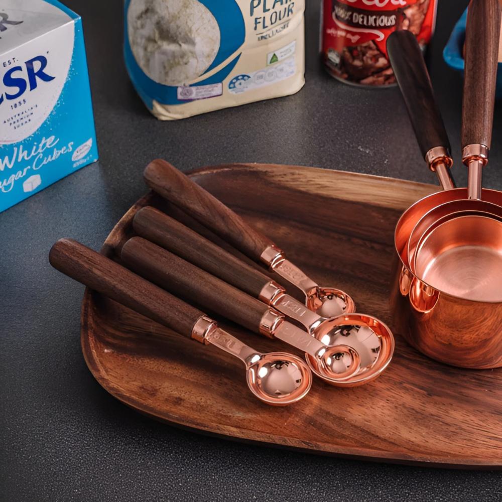 Copper measuring cups and spoons in use at home