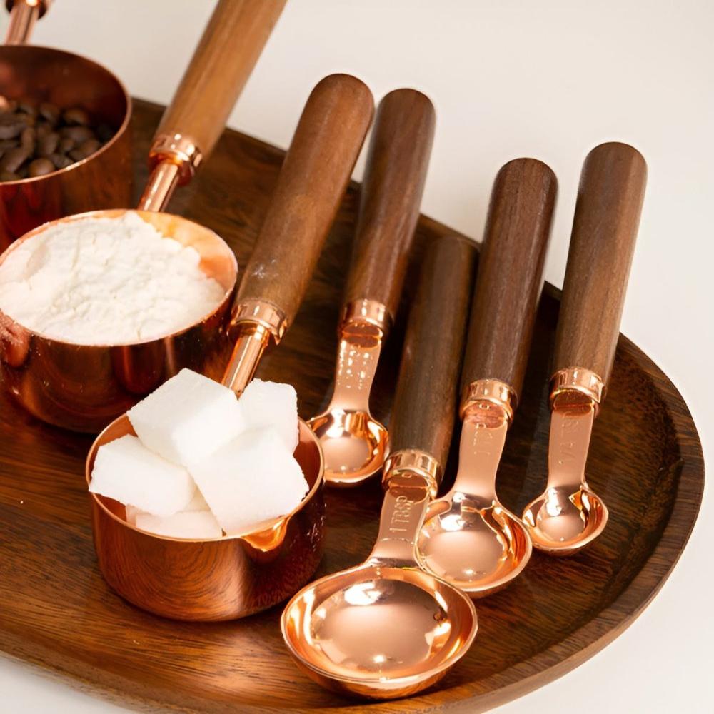 Copper measuring cups and spoons styled view