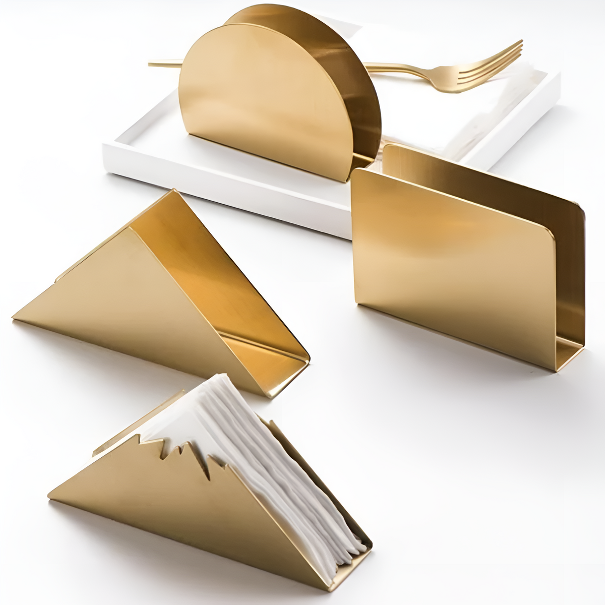 Gold metallic napkin holder shown on a dining table