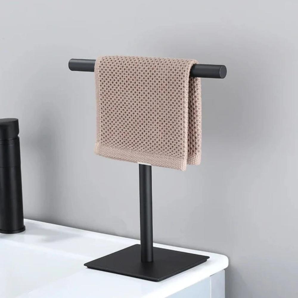 Freestanding towel rack on a bathroom countertop