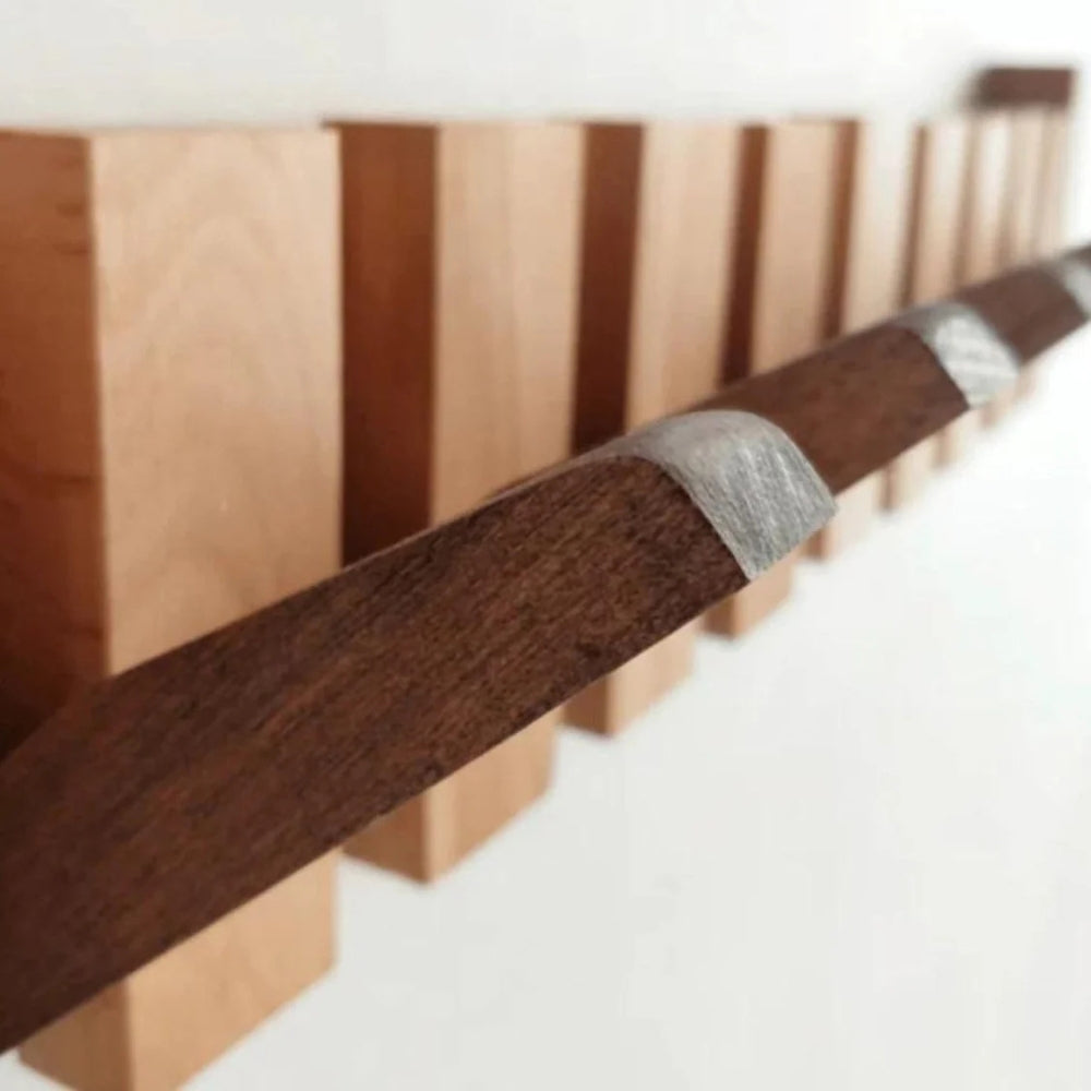 Piano style wooden flip hook rack detail view