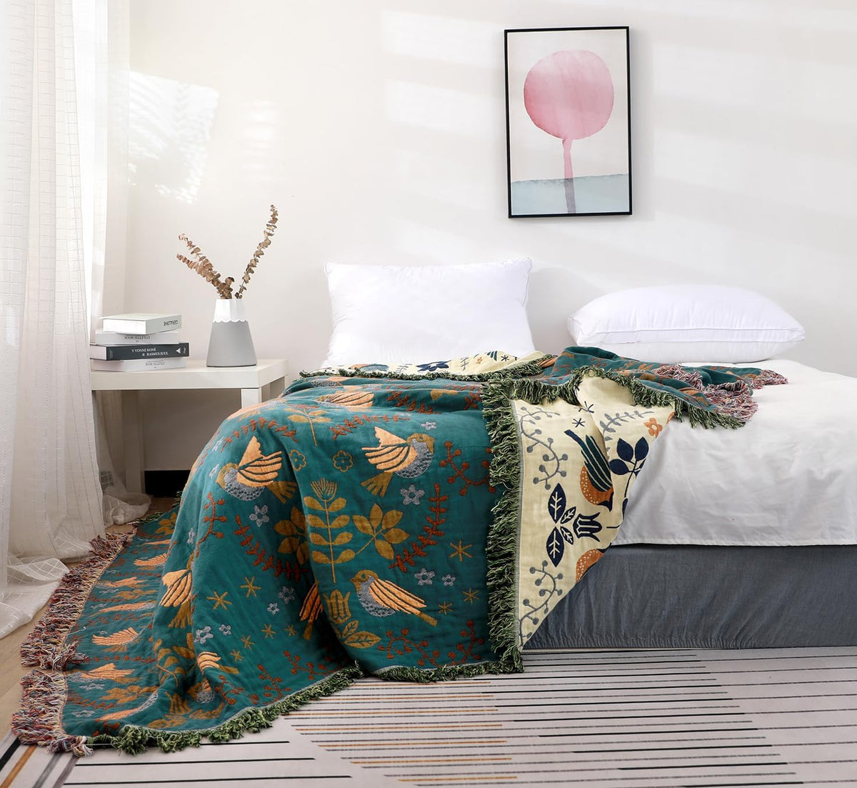 Scandinavian bird cotton blanket on a bed