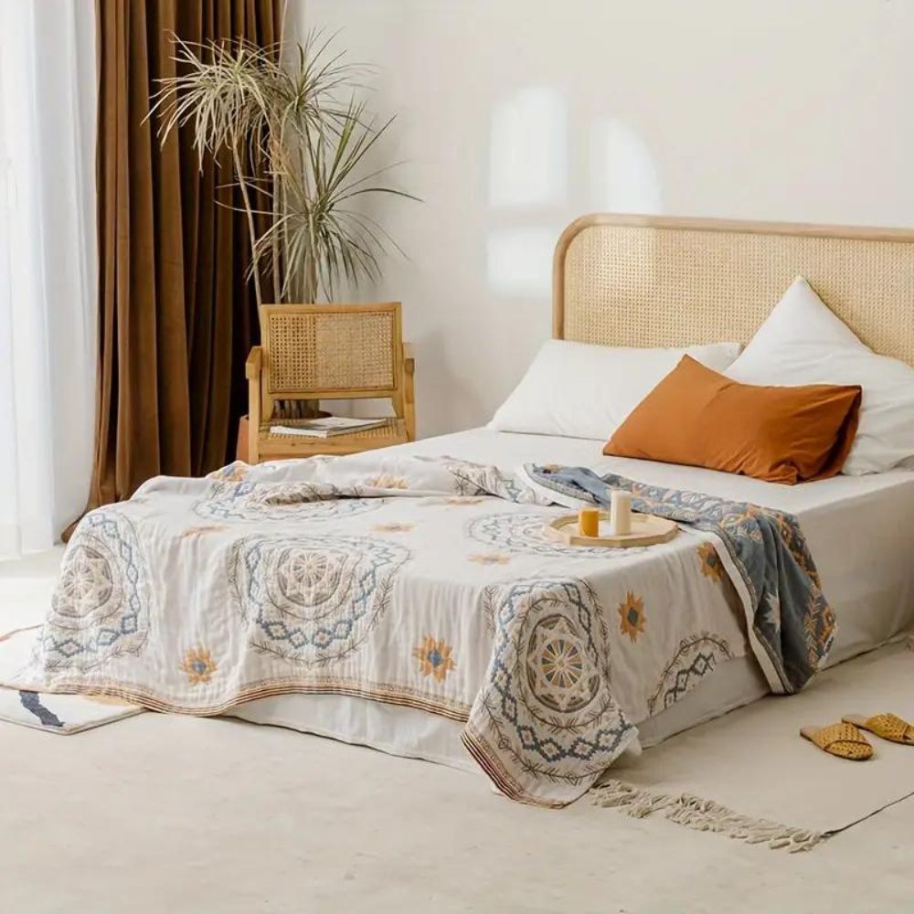 Serene mandala cotton throw blanket on a bed