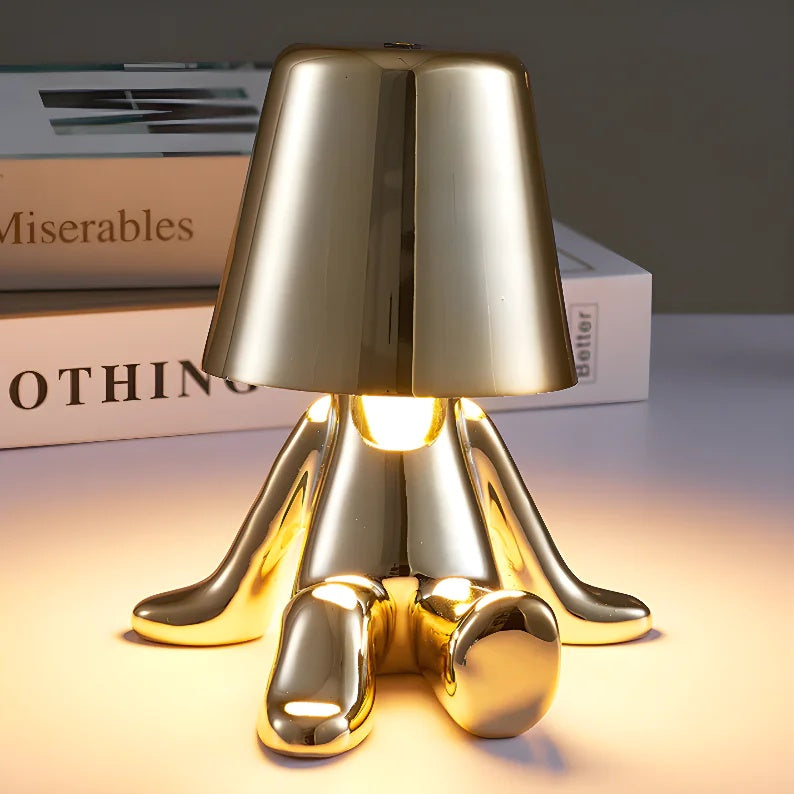 Thinker sculpture table lamp shown in a home setting